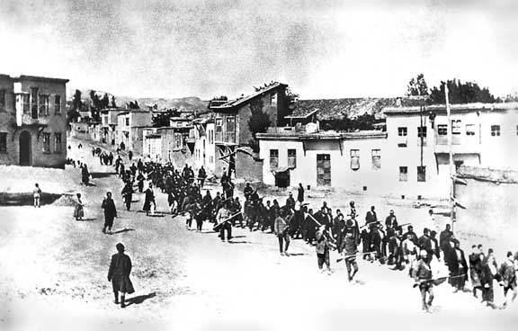Armenians are marched to a nearby prison in Mezireh by armed Turkish soldiers. Kharpert, Armenia, Ottoman Empire - April, 1915. *From the collection of Project SAVE Armenian Photograph Archives. Photographed by an anonymous German traveler.